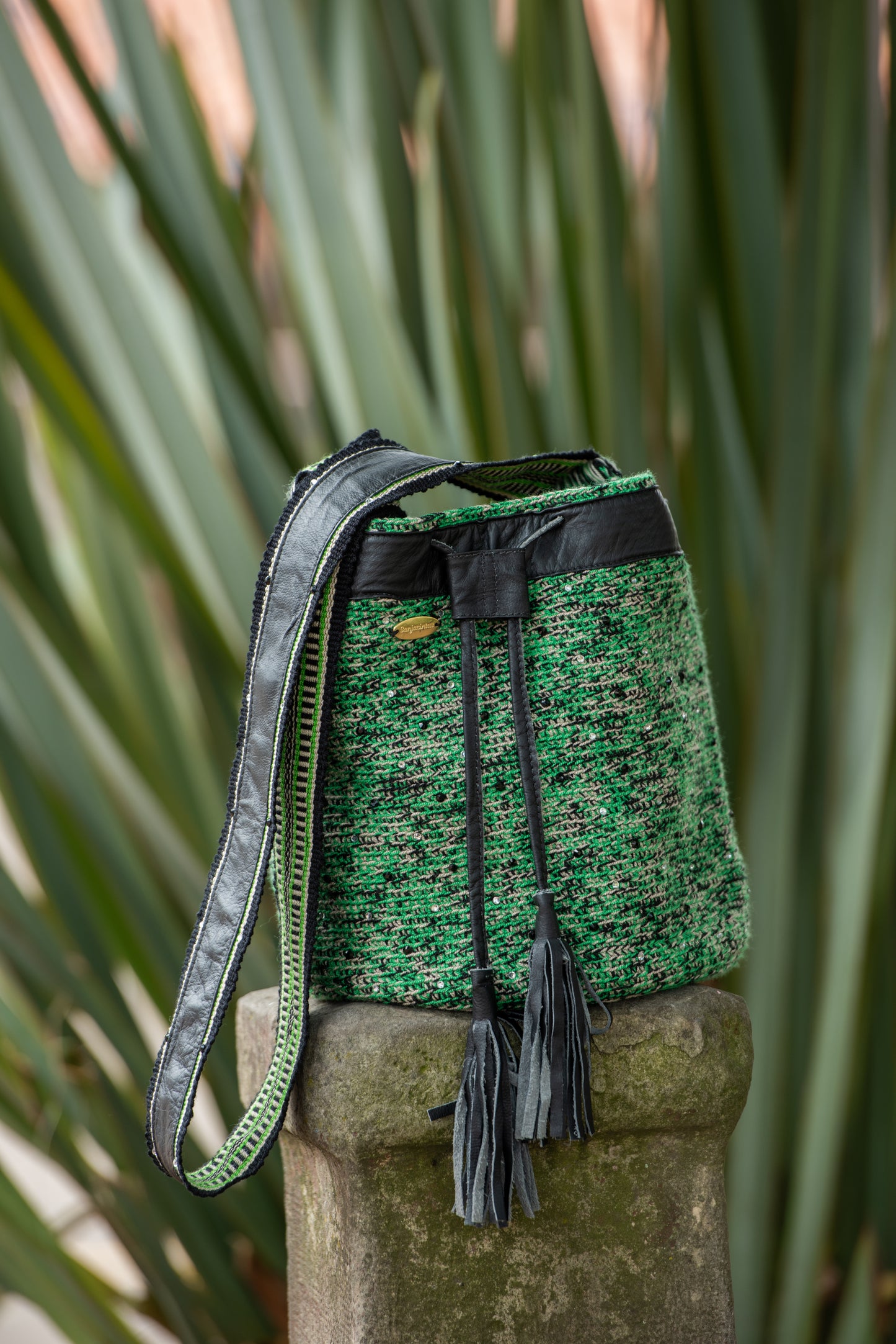 Leather Black and green Wayuu bag .